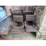 A folding steel framed garden table with stained wooden slatted top together with a set of four