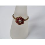 A 9ct gold ruby and diamond flower head ring, size O, 2g