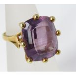 A cushion cut amethyst and yellow metal ring in claw setting, size J/K, 7g