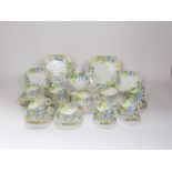 A collection of Paragon China art deco teawares with printed and infilled blue floral border