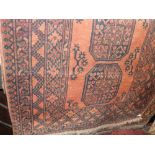 Two similar Persian style floor rugs each decorated with black medallions upon an orange ground (2),