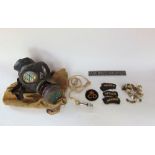 Military interest - the contents of an air raid warden's cabinet to include patches, gas mask,