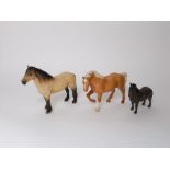 A collection of three Beswick horses and ponies including a Highland pony, a Palomino pony and a