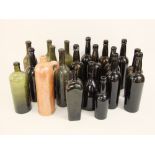 A collection of 19 antique glass wine/ale bottles, together with a further salt glazed bottle (20)