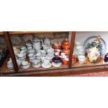 A quantity of ceramics including continental orange ground tea and coffeewares with gilt and black