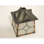 An Arts & Crafts style anodised copper framed porch lantern of square tapered form with frosted