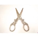 A pair of Dutch silver grape scissors, each cast with children in grapevine, 13 cm long