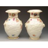 A pair of unusual 19th century cream ground vases with painted floral sprigs and sprays and with