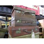 Three good quality heavy leather vintage suitcases.