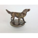 Cast white metal car mascot in the form of a standing spaniel