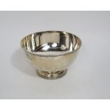 An impressive silver pedestal fruit or punch bowl with gadrooned rim and stepped circular base,