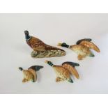 A Beswick model of a standing pheasant with impressed number to base 1225 and circular printed