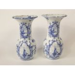 A pair of large 19th century vases with printed blue and white decoration in the Dutch Delft