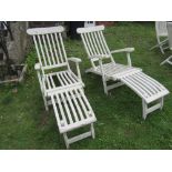 A pair of teak steamer type folding garden armchairs with slatted seats and backs (later painted