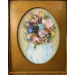 An oil painting on canvas of a still life with vase of flowers signed bottom right Ena Russell,