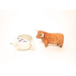 A Beswick model of a Highland bull, together with a late 19th century Boer War invalid feeding cup