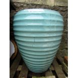 A large good quality contemporary garden planter/urn of circular tapered form, ribbed detail and