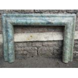 A moulded pine fire surround with decorative painted to simulate marble finish