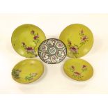 Two pairs of 19th century oriental yellow ground dishes with incised pattern decoration and