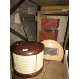 A vintage H M V electric heater of demi-lune form with Bakelite top and skirting, one other, three