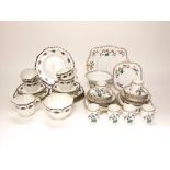 A collection of Delphine art deco tea wares with enamelled style fruit border decoration