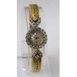 Jaeger Le Coultre ladies cocktail watch with diamond set bezel and 18ct strap, within an original