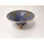 A Carltonware blue ground bowl of flared form with painted and gilded forest tree decoration, raised