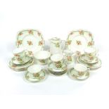 A quantity of Paragon china Queen Alexandra Rose pattern tea wares comprising water jug, milk jug,