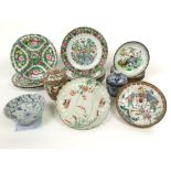 A collection of oriental ceramics including a plate with scalloped border and polychrome painted