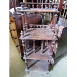 A 19th century four tier oak Canterbury whatnot with turned spindles and mouldings