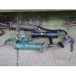 Four small cast iron hand operated water pumps of varying design