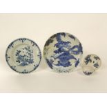 A late 19th century oriental dish with blue and white painted dragon cloud decoration with six