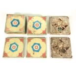 A set of ten early 20th century Mintons tiles with blue, pink and cream coloured stylised flora