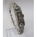 A lady's Art Deco diamond wristwatch, Josarn, the rectangular dial with black Arabic numerals,