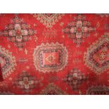 Massive country house carpet decorated with various Islamic medallions upon a red ground