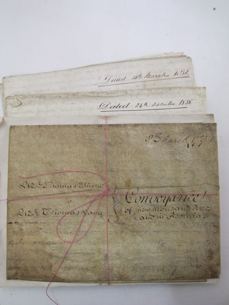 A collection of 19th century legal documents including various conveyances and mortgage assignments,