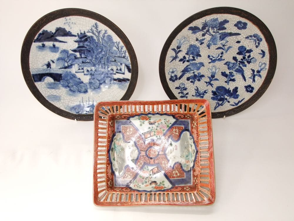 An oriental dish of rectangular form with pierced border decoration painted in gilded Imari type