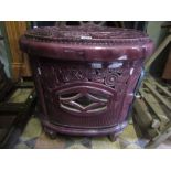 A vintage Deville & Co Ltd free standing cast iron purple coloured enamel stove of oval form with