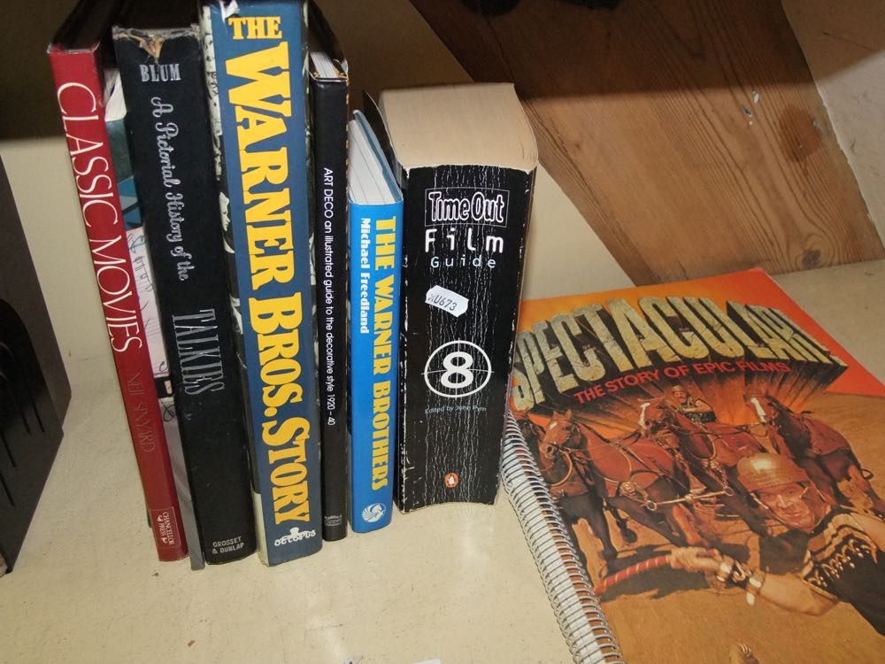 A collection of books about film and cinema including Spectacular - The Story of Epic Films,