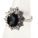 An 18ct white gold diamond and sapphire ring, size J/K, 5g