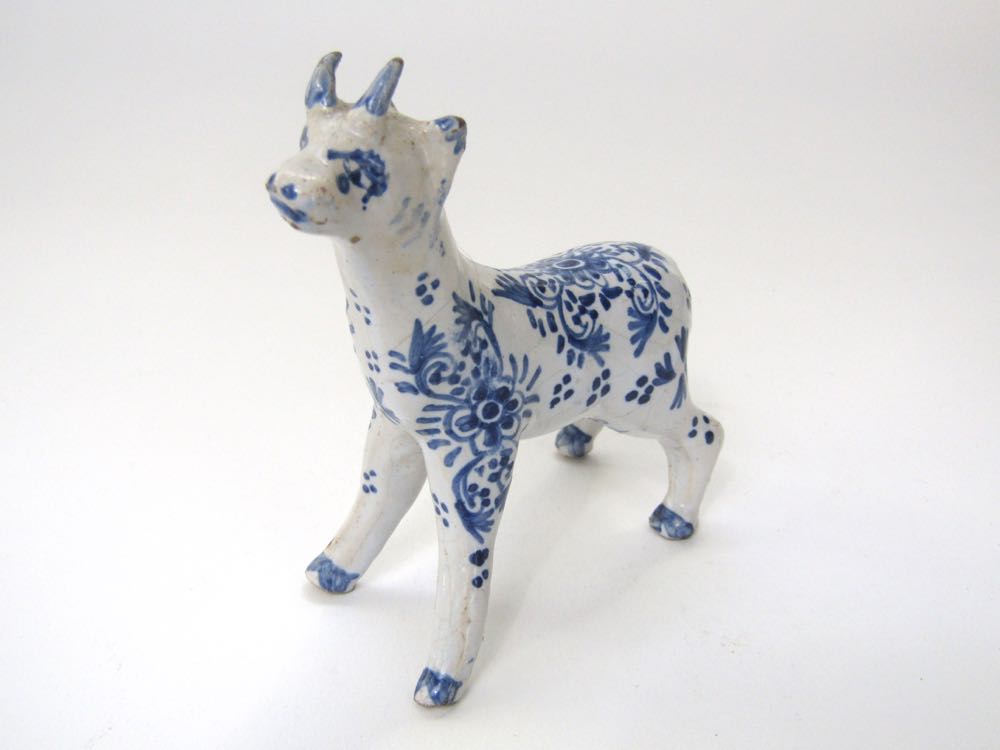 A small 19th century Delft model of a goat-like animal with blue and white painted floral decoration - Image 2 of 2