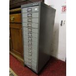 A Bisley steel filing cabinet fitted with fifteen shallow index filing drawers