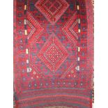 Meshwari runner, decorated with diamond shaped medallions upon a bleu ground, 258 x 60cm