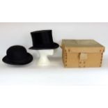 A good boxed Lock & Co brushed silk top hat within original box with brush together with a further G