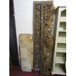 A pair of Indonesian hardwood friezes with deep carved bird, branch and foliate detail with