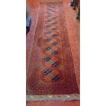 Persian Keshan type runner with central geometric medallion decoration with blues upon an orange