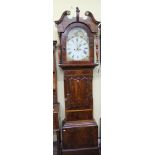 A mid 19th century north country longcase clock, the inlaid case supporting a hood with turned