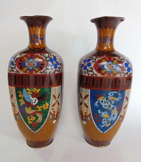 A pair of square baluster cloisonne vases with panels of birds, dragons, etc., 31 cm high approx (