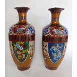 A pair of square baluster cloisonne vases with panels of birds, dragons, etc., 31 cm high approx (