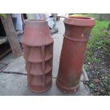 A reclaimed terracotta chimney pot of cylindrical form with Louvre vents, together with one other